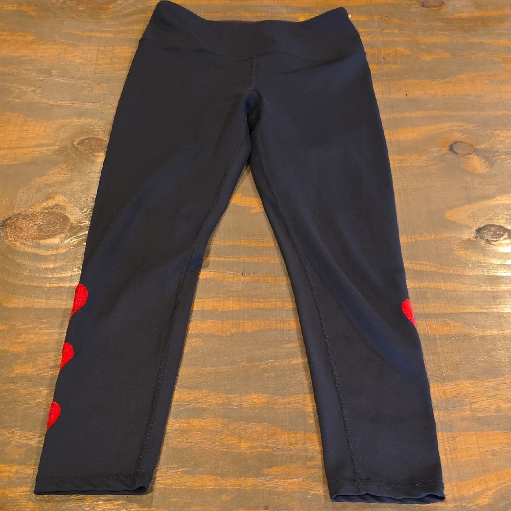 Chic Black Leggings with Red Heart Details